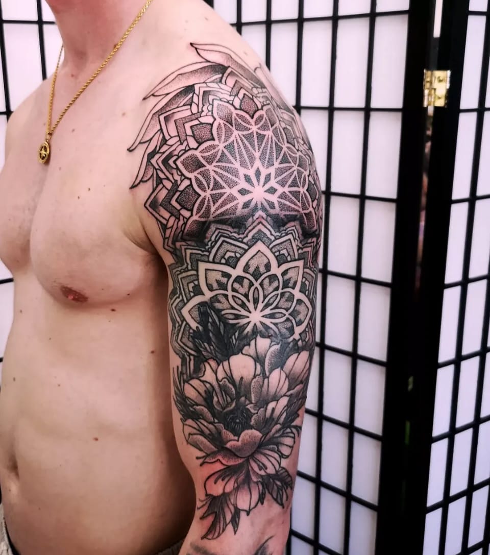 Dotwork mandala and floral half sleeve by Chris
