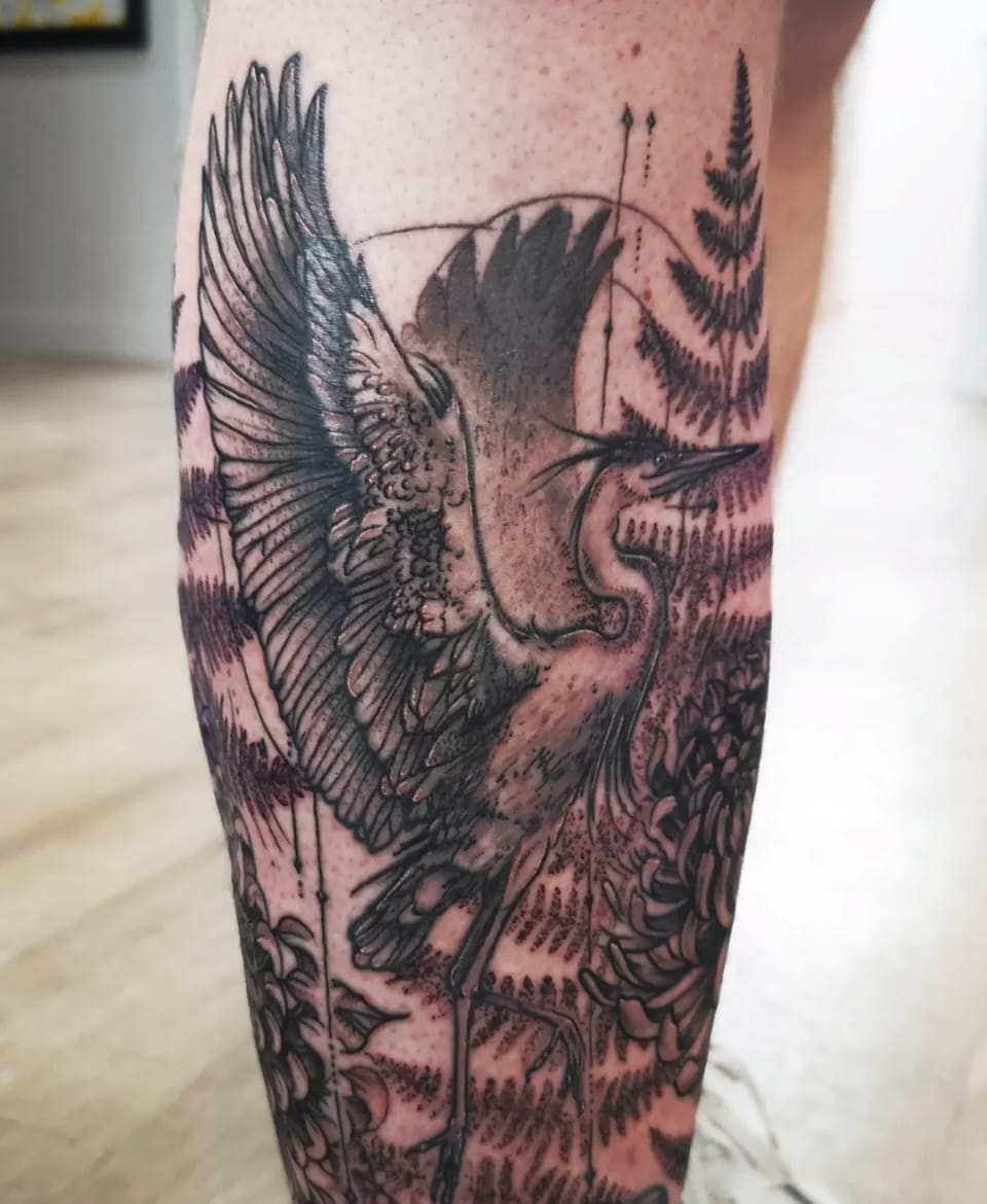 Illustrative heron and fern leg tattoo by Chris