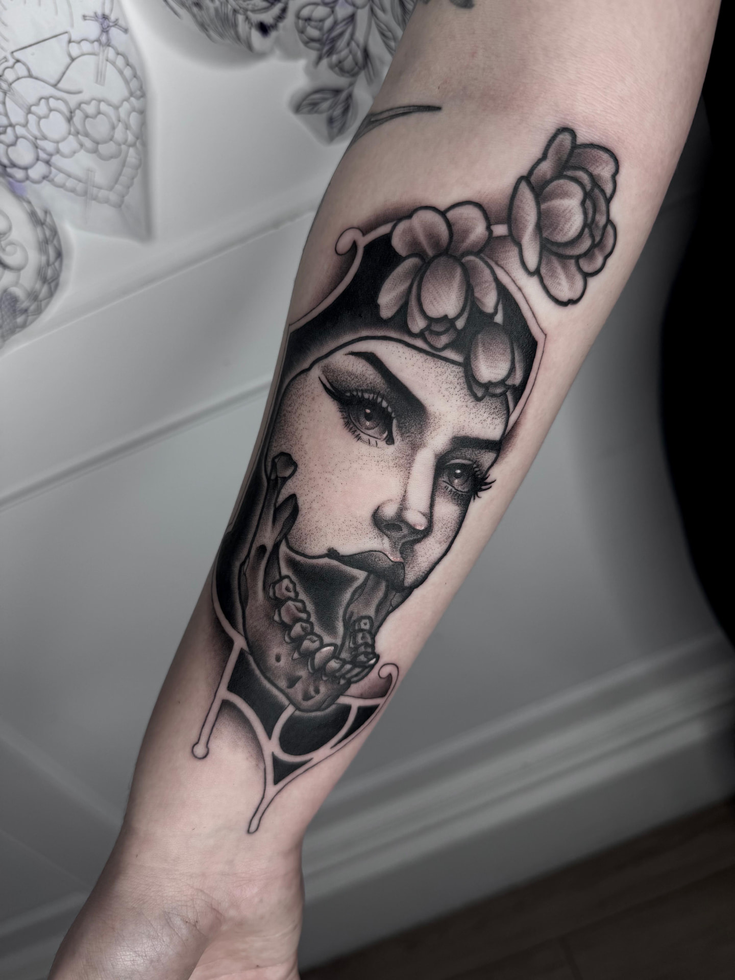Woman portrait with skull jaw and flowers by Greg