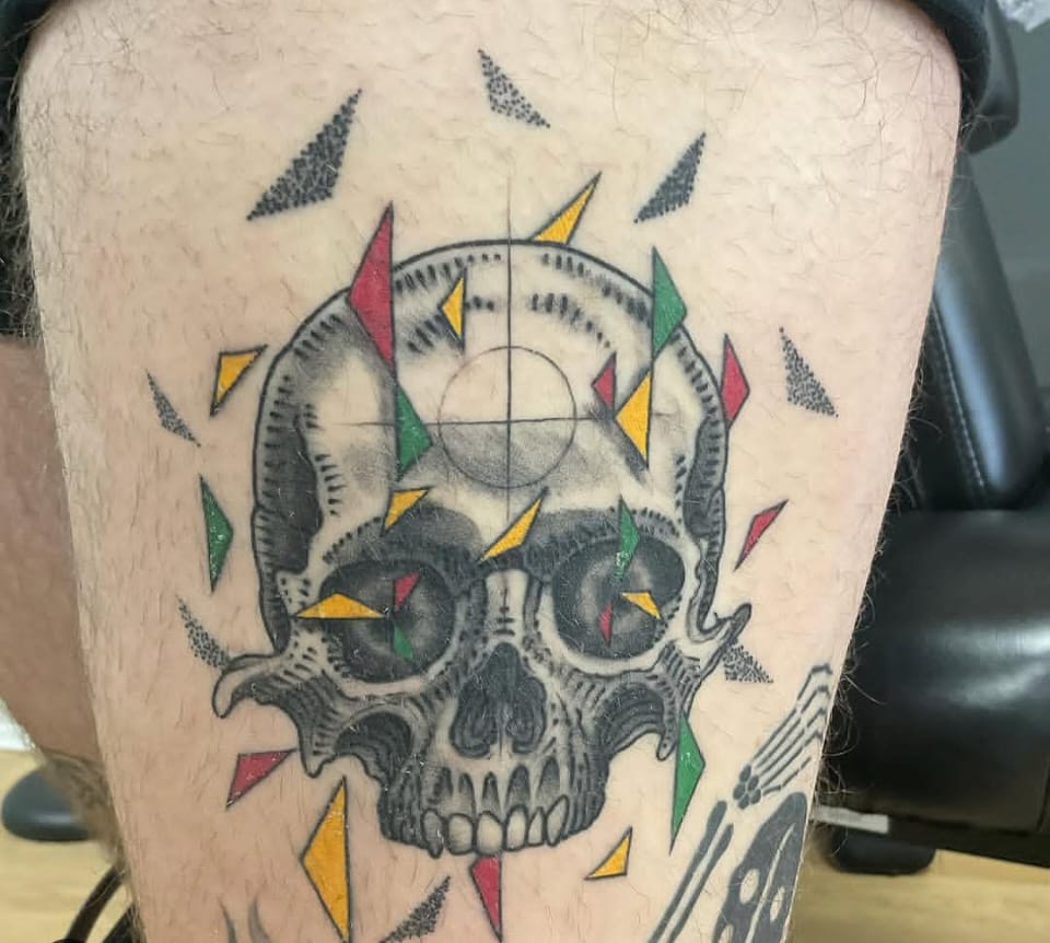 Skull with coloured geometric shards by Sikes