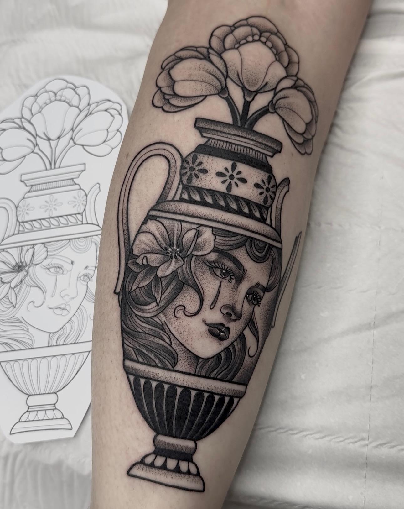 Womans face in a Greek urn with flowers by Greg